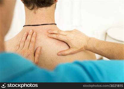 An image of a young man at the physio therapy with pain
