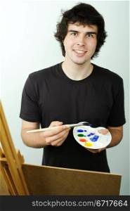 An image of a young painter drawing a picture
