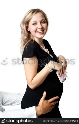 An image of a young pregnant woman with little shoes
