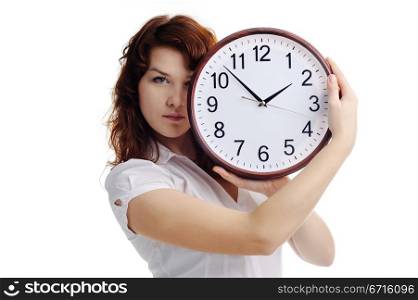 An image of a young woman with a clock