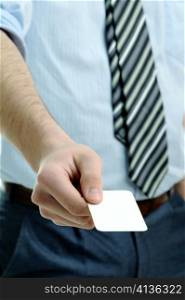 An image of businessman holding business card