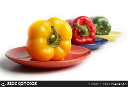 An image of color peppers on a saucers
