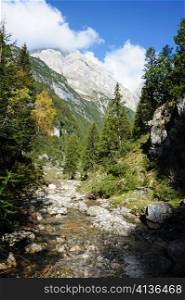An image of great italian mountains and a stream