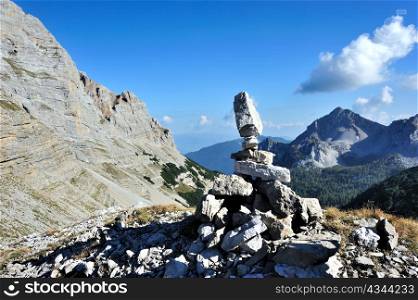 An image of grey stone of mountains and blue sky