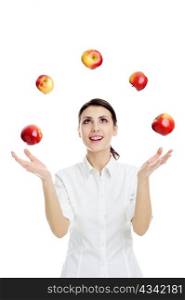An image of happy young woman playing with red apples
