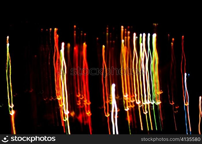 An image of multicoloured christmas lights on black sky