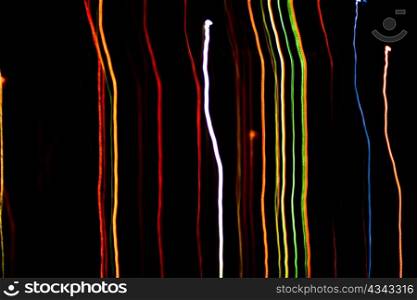 An image of multicoloured christmas lights on black sky