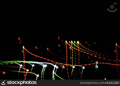 An image of multicoloured festive lights on dark sky