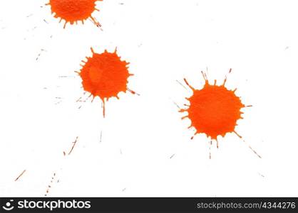 An image of orange spots on white paper
