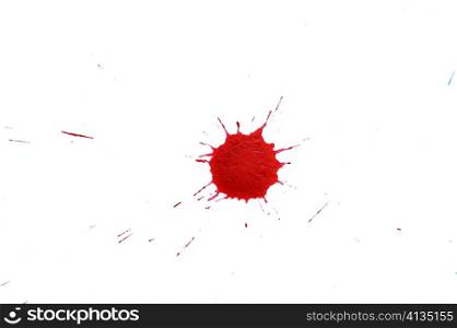 An image of red splash on white paper