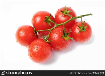 An image of red tomatoes with drops of water on them