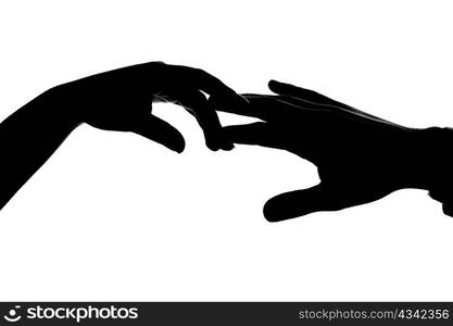 An image of silhouette of two hands. Man and woman.