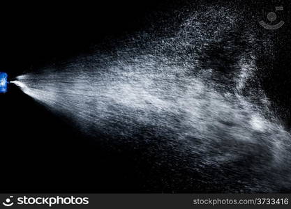 An image of water as it it sprayed out of the nozzle of a spray bottle