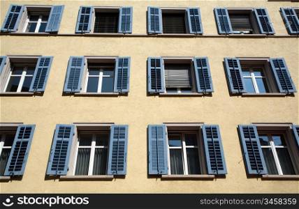 An image of windows of a big house