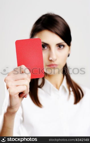 An image of young beautiful woman holding red card