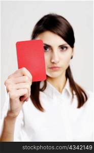 An image of young beautiful woman holding red card