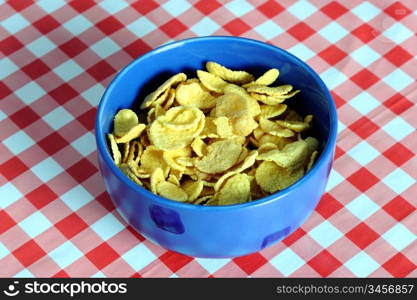 An images of cereal flakes in a blue bowl