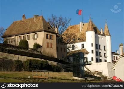 An imposing castle-style building, beside a road, near Lausanne, Switzerland
