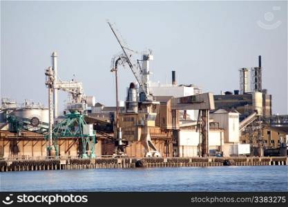 An industrial shipping dock on the sea