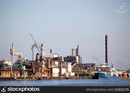 An industrial shipping dock on the sea