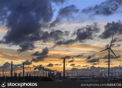 An industrial skyline at dusk - Rotterdam in the Netherlands.