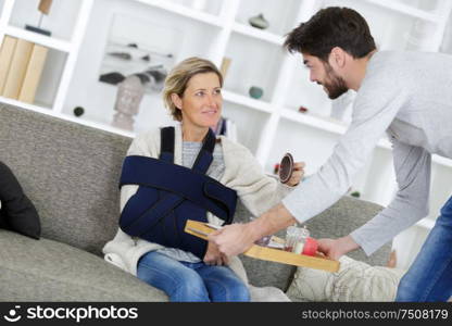 an injured woman with helper