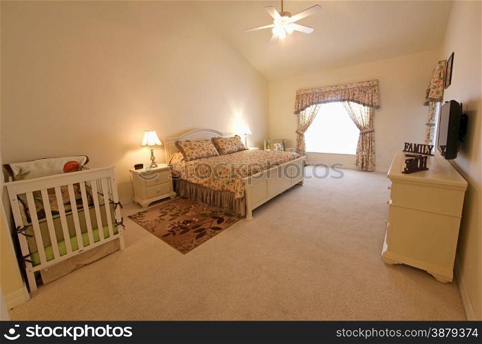 An interior shot of a master bedroom