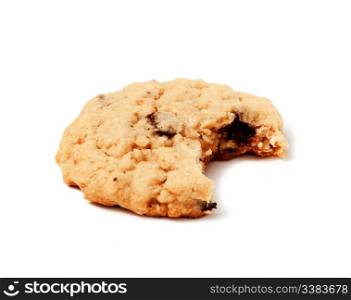 An isolated chocolate chip cookie with a bite out of it