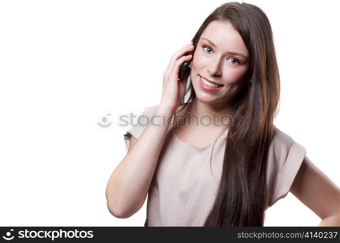 An isolated shot of a beautiful caucasian businesswoman talking on the phone
