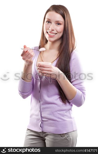 An isolated shot of a beautiful caucasian woman eating yogurt