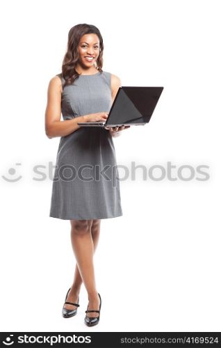 An isolated shot of a black businesswoman holding a laptop