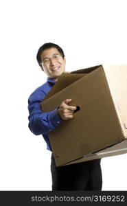 An isolated shot of a businessman carrying a box, can be used as business moving concept