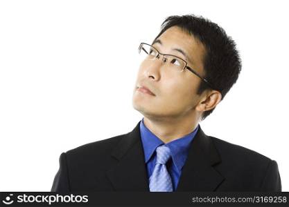 An isolated shot of a businessman looking up