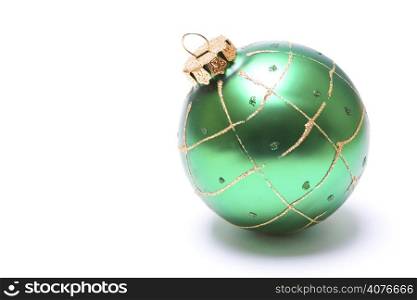 An isolated shot of a green christmas ornament