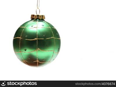 An isolated shot of a green christmas ornament