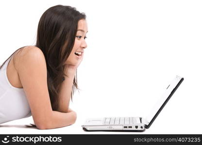 An isolated shot of a happy beautiful asian woman working on her laptop