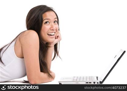 An isolated shot of a happy beautiful asian woman working on her laptop