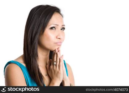 An isolated shot of a thinking beautiful asian woman