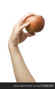 An isolated shot of a woman holding an apple