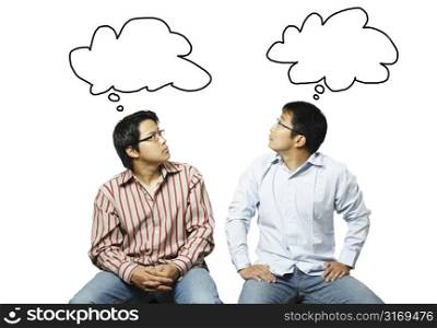 An isolated shot of two businessmen reading each other&acute;s thoughts