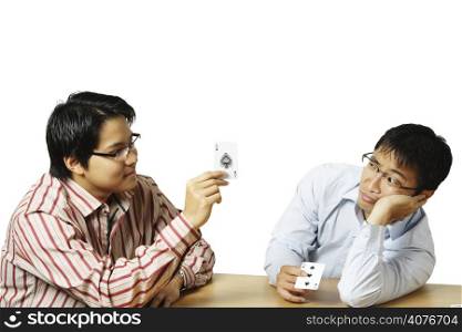 An isolated shot of two men playing cards