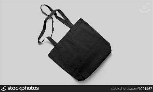 An isolated view of the black Tote bag on an grey background.