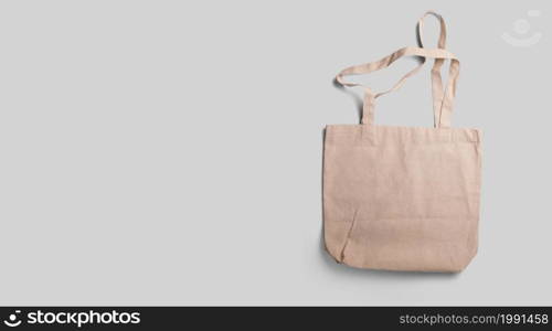 An isolated view of the brown Tote bag on an grey background.