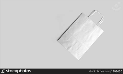 An isolated view of the white Tote bag on an grey background.