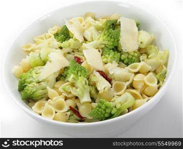 An Italian-style romanescu and pasta meal, cooked with chopped sun-dried tomatoes and topped with slivers of parmesan cheese. The romanescu cauliflower (or cabbage or broccoli - the names vary) fllorets are parboiled then fried before being tossed with the pasta.