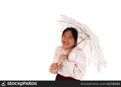 An Malayan woman with a embroidered sun-umbrella wearing a satinblouse, smiling into the camera for white background.
