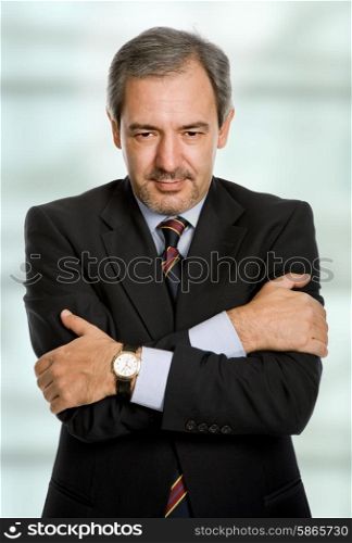 an mature business man portrait looking mad