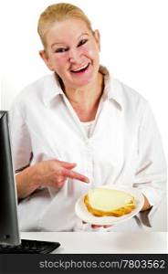 An office employee shows with the index finger on a slice of bread