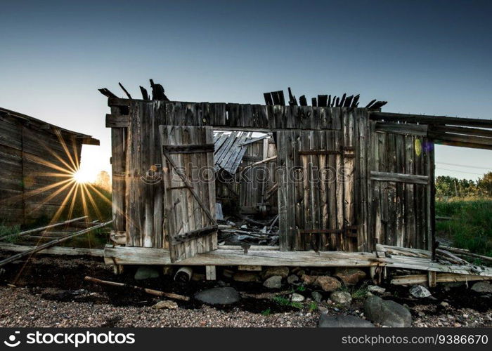 An old abandoned wooden cabins at coastline. Karelia. High quality photo. An old abandoned wooden cabins at coastline. Karelia