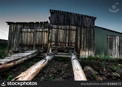 An old abandoned wooden cabins at coastline. Karelia. High quality photo. An old abandoned wooden cabins at coastline. Karelia